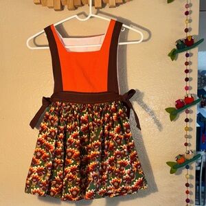 NWOT HANDMADE THANKSGIVING GIRLS SMOCK STYLE DRESS. no size tag,
